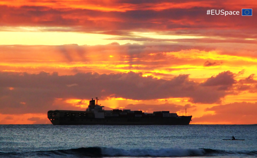 cargo ship on the sea at sunset